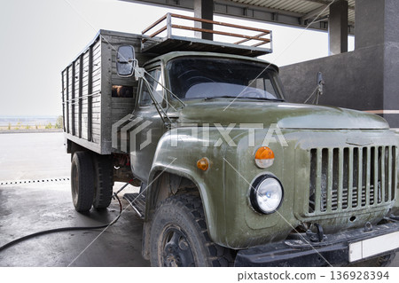 A retro, active truck transporting gas-fed sheep 136928394