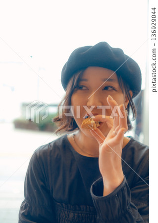 A woman in her 30s enjoying breakfast A woman in her 30s enjoying breakfast 136929044