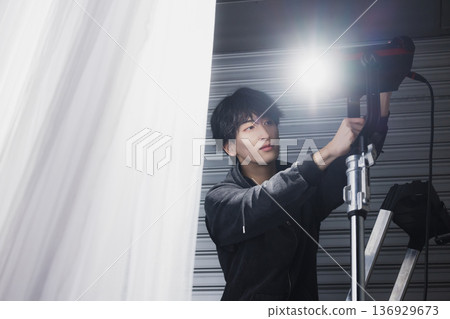 Man working in a photography studio 136929673