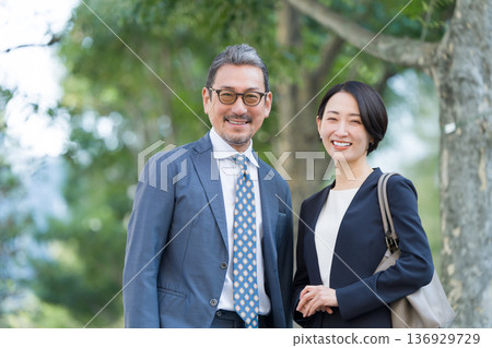 Smiling businessmen and women 136929729