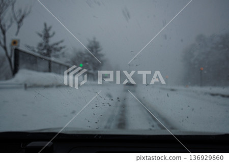 Highway moving through heavy snow due to explosive atmospheric pressure Highway moving through heavy snow due to explosive atmospheric pressure 136929860