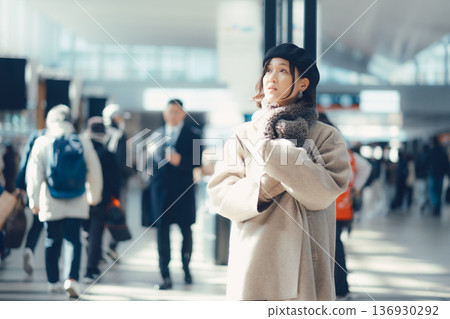 A woman in her 30s waiting indoors 136930292