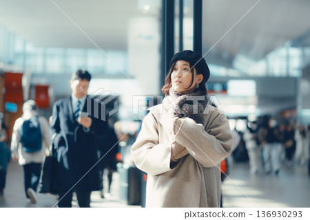 A woman in her 30s waiting indoors A woman in her 30s waiting indoors 136930293