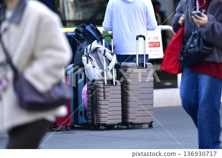 Tokyo cityscape in Japan Inbound tourism continues... suitcases... father keeps watch while mother and daughter leave their luggage and go somewhere = Shibuya Tokyo cityscape in Japan Inbound tourism continues... suitcases... father keeps watch while mother and daughter leave their luggage and go somewhere = Shibuya 136930717