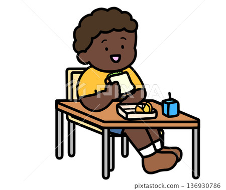 School Life: A black boy eating lunch at his desk (sandwich) 136930786