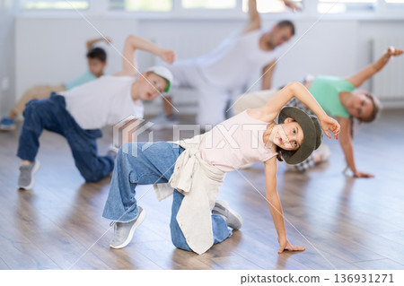Tween girl mastering krump dance in children dance studio 136931271