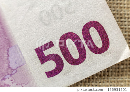 Money, busyness and finances concept. Detail part of five hundred banknote euro national currency bill. Symbol of wealth and prosperity. 136931301