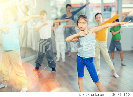 Dance class for kids, girls and boys training in dance studio Dance class for kids, girls and boys training in dance studio 136931340