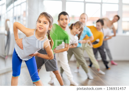 Group of children warming up before dance class 136931457