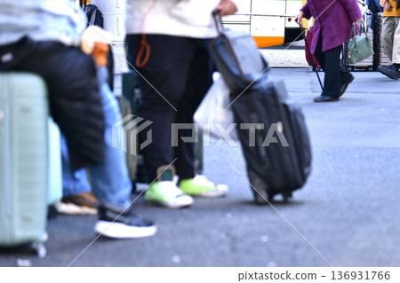 Tokyo cityscape in Japan: Aging society and inbound tourism...suitcase...elderly woman in a swimsuit...what is the future of Japan...=Shibuya 136931766