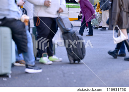 Tokyo cityscape in Japan: Aging society and inbound tourism...suitcase...elderly woman in a swimsuit...what is the future of Japan...=Shibuya Tokyo cityscape in Japan: Aging society and inbound tourism...suitcase...elderly woman in a swimsuit...what is the future of Japan...=Shibuya 136931768