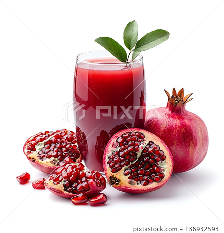 Fresh Pomegranate Juice in Glass with Halved Pomegranate and Seeds on White Background Fresh Pomegranate Juice in Glass with Halved Pomegranate and Seeds on White Background 136932593