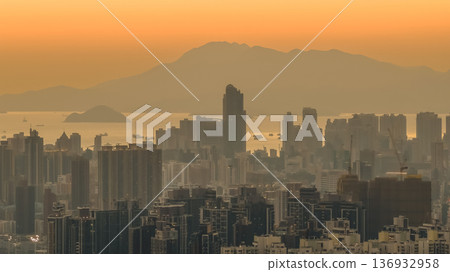 Jan 11 2026 Mong Kok cityscape with dense buildings under sunset glow Jan 11 2026 Mong Kok cityscape with dense buildings under sunset glow 136932958