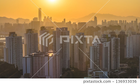 Jan 11 2026 Golden Sunset Over Kowloon Skyline and Victoria Harbour View Jan 11 2026 Golden Sunset Over Kowloon Skyline and Victoria Harbour View 136933036