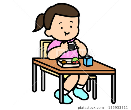 Lunchtime: Asian girl eating rice balls at her desk Lunchtime: Asian girl eating rice balls at her desk 136933511