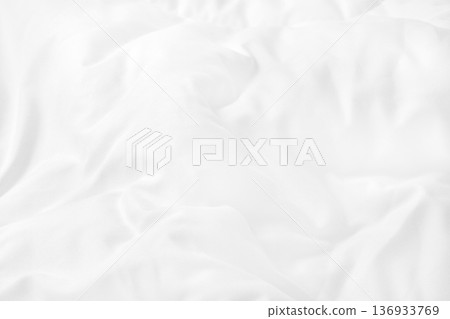 Close up top view of white bedding sheet and wrinkle messy blanket in bedroom after wake up in the morning. Close up top view of white bedding sheet and wrinkle messy blanket in bedroom after wake up in the morning. 136933769