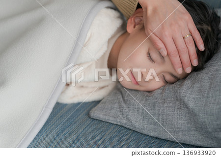 A sick girl and her mother caring for her A sick girl and her mother caring for her 136933920