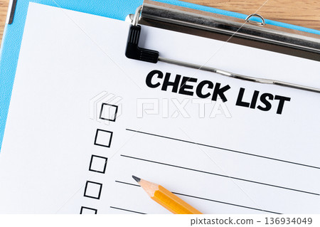 Checklist paper and pencil in a binder Checklist paper and pencil in a binder 136934049