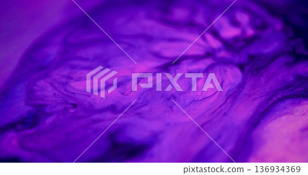 Neon paint defocused. Blob spill. Purple pigment drop dissolving on pink blue color fluid. Watercolor stream mix abstract background. 136934369