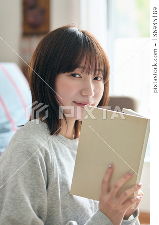 A woman reading A woman reading 136935189