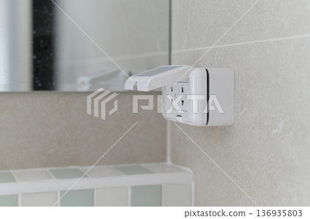 Electrical outlet wall bathroom safety cover white tile modern protection indoor horizontal. Electrical outlet with safety cover tiled bathroom wall modern and clean design white color indoor Electrical outlet wall bathroom safety cover white tile modern protection indoor horizontal. Electrical outlet with safety cover tiled bathroom wall modern and clean design white color indoor 136935803