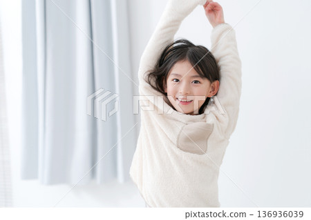 Girl relaxing in pajamas Girl relaxing in pajamas 136936039