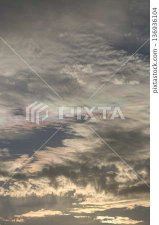 A sky shining with rainbow clouds 136936104