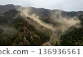 A landscape of cedar forests and a large amount of cedar pollen flying from the mountains in spring 136936561