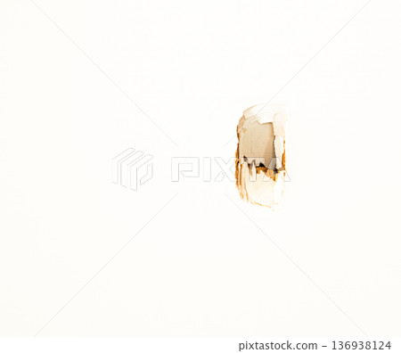 Image of a cracked hole in a white door 136938124