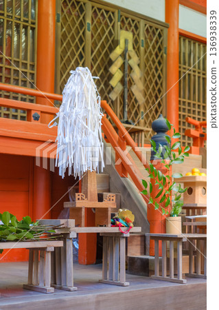 An altar prepared for a Shinto ritual at a shrine: Onusa (hemp) and offerings 136938339