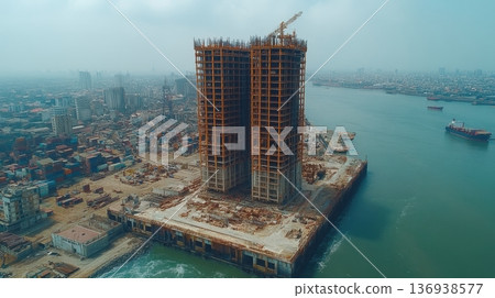 Construction of twin skyscrapers on a waterfront site Construction of twin skyscrapers on a waterfront site 136938577