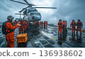 Military helicopter landing on aircraft carrier in stormy weather 136938602