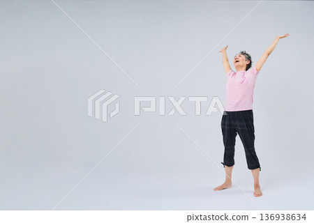 Senior women doing flexibility exercises Senior women doing flexibility exercises 136938634