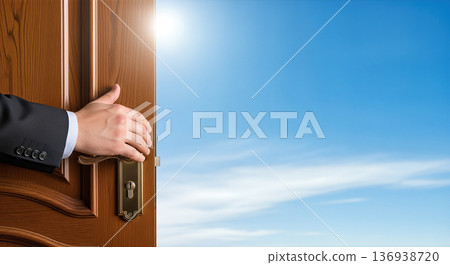 Businessman hand opening wooden door to blue sky sun light concept of opportunity freedom new beginning future success hope dream Businessman hand opening wooden door to blue sky sun light concept of opportunity freedom new beginning future success hope dream 136938720