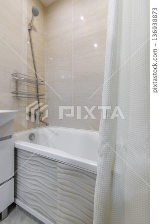 Modern Bathtub Area with White Curtain and Beige Tiles Modern Bathtub Area with White Curtain and Beige Tiles 136938873