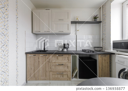 Modern Compact Kitchen with Light Wood Cabinets Modern Compact Kitchen with Light Wood Cabinets 136938877