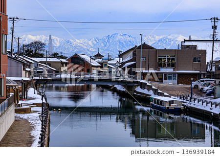 Snow scenery in the Uchikawa district of Imizu City, Toyama Prefecture, with the Tateyama mountain range in the background Snow scenery in the Uchikawa district of Imizu City, Toyama Prefecture, with the Tateyama mountain range in the background 136939184