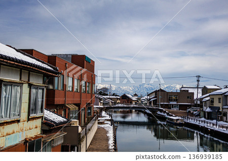 Snow scenery in the Uchikawa district of Imizu City, Toyama Prefecture, with the Tateyama mountain range in the background Snow scenery in the Uchikawa district of Imizu City, Toyama Prefecture, with the Tateyama mountain range in the background 136939185