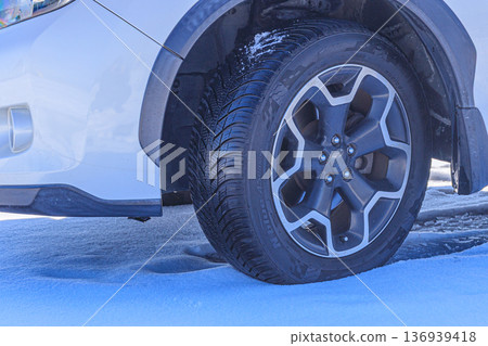 Four-wheel drive vehicles with all-season tires can safely drive on snowy roads 136939418