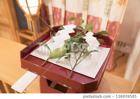 Image of a Shinto priest offering a prayer Image of a sakaki tree Image of a Shinto priest offering a prayer Image of a sakaki tree 136939585