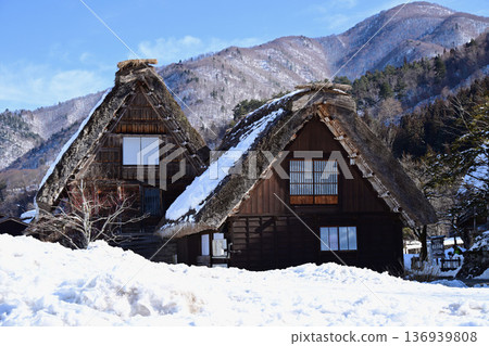 Gassho-style houses covered in snow Gassho-style houses covered in snow 136939808
