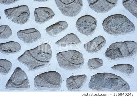 Stone wall texture background with natural masonry pattern and rough surface 136940242