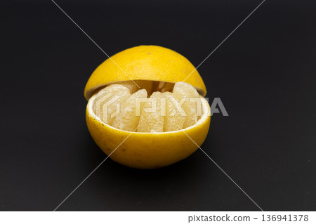 Stock photo of sour pomelo: A cute arrangement of large citrus fruits peeled and arranged on the skin Stock photo of sour pomelo: A cute arrangement of large citrus fruits peeled and arranged on the skin 136941378