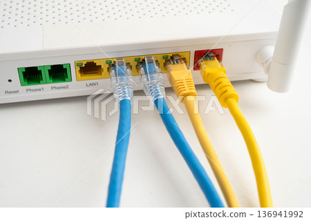 Ethernet cable with wireless router connect to internet service provider network. 136941992