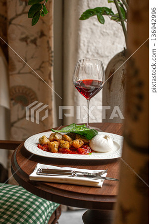 Burrata with roasted chicken and red wine Burrata with roasted chicken and red wine 136942996