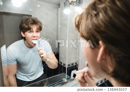 Brushing teeth with toothpaste foam. Brushing Teeth Brushing teeth with toothpaste foam. Brushing Teeth 136943037