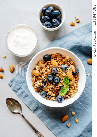Baked granola with yogurt and blueberries. Baked granola with yogurt and blueberries. 136944368