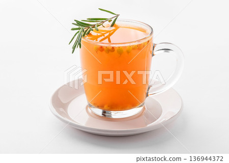 Hot sea buckthorn drink with spices. 136944372