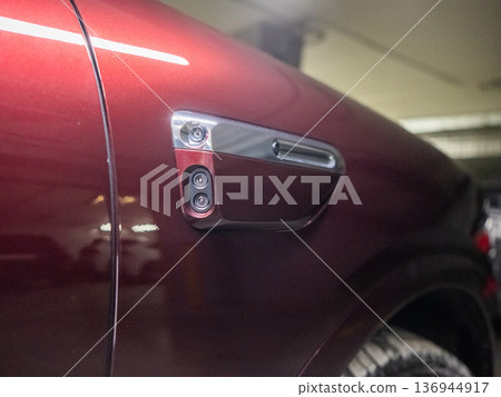 Cameras on the body of a red car. Cameras on the body of a red car. 136944917