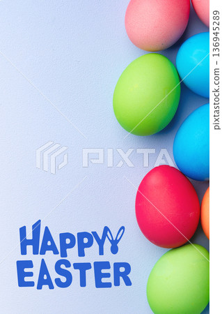 Colorful eggs and happy easter greeting on a light blue background in spring season Colorful eggs and happy easter greeting on a light blue background in spring season 136945289